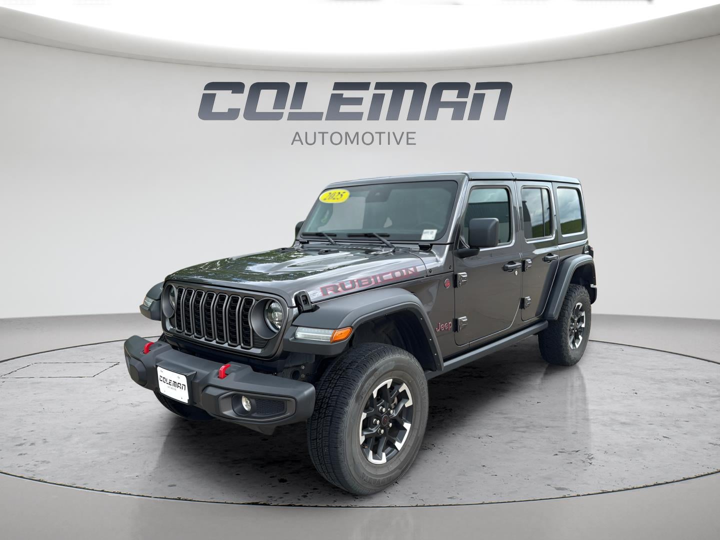2025 Jeep Wrangler 4-Door Rubicon 4x4 in Granite Crystal Metallic Clearcoat — front three-quarter view