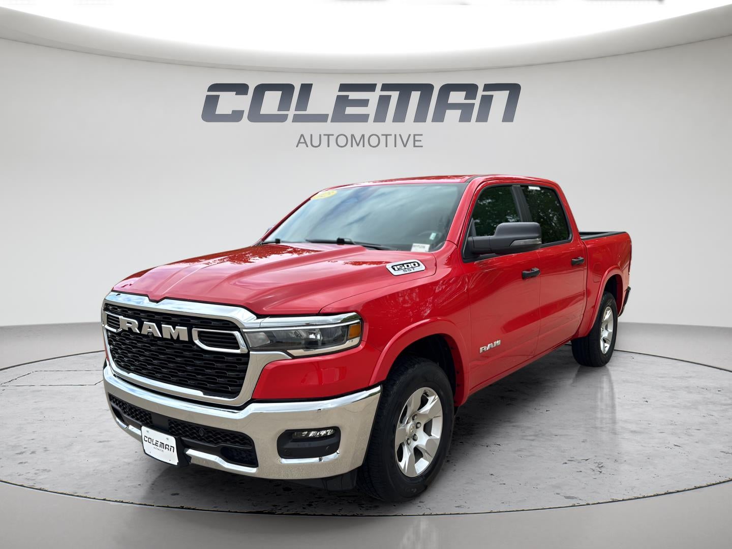 2025 RAM 1500 Big Horn Crew Cab 4x4 5'7' Box in Flame Red Clearcoat — front three-quarter view