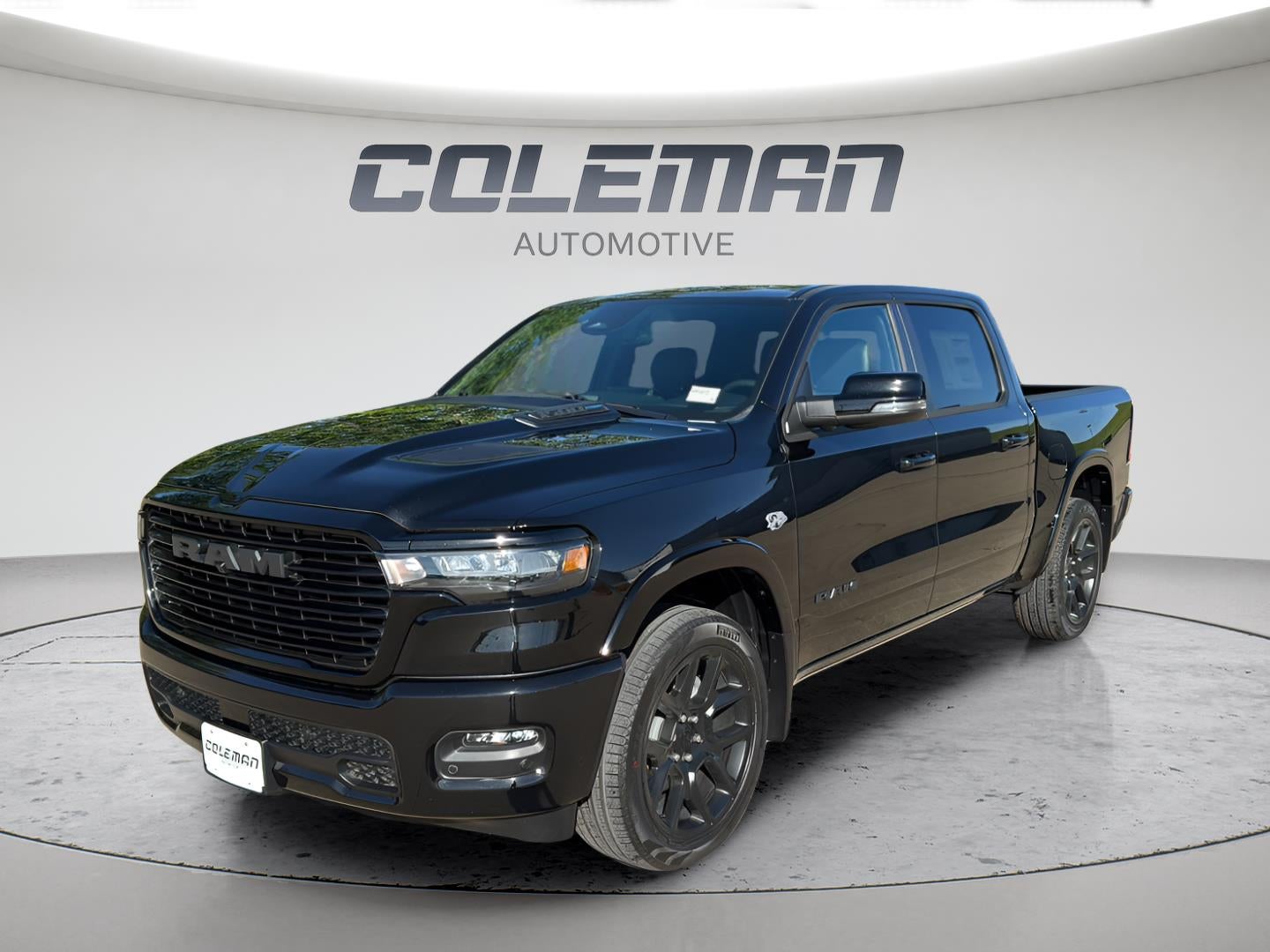 2026 RAM 1500 Laramie in Diamond Black Crystal Pearlcoat — front three-quarter view