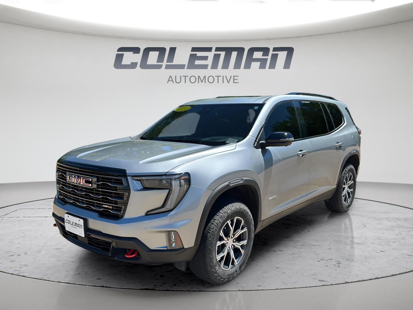 2024 GMC Acadia AWD AT4 in Sterling Metallic — front three-quarter view