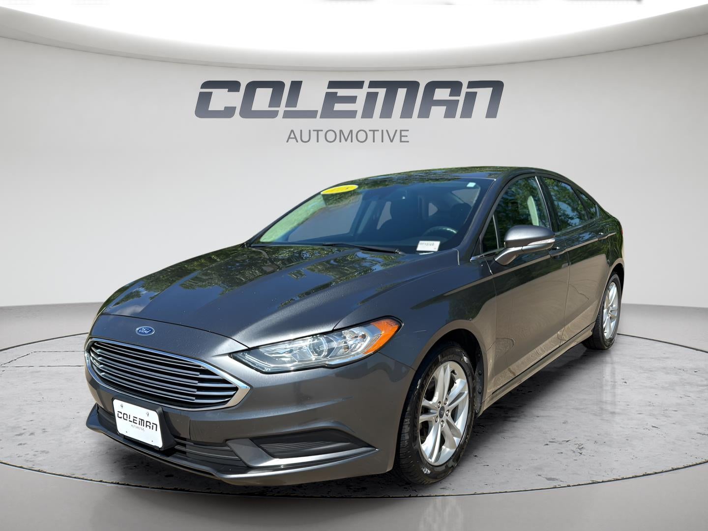 2018 Ford Fusion SE in Magnetic — front three-quarter view