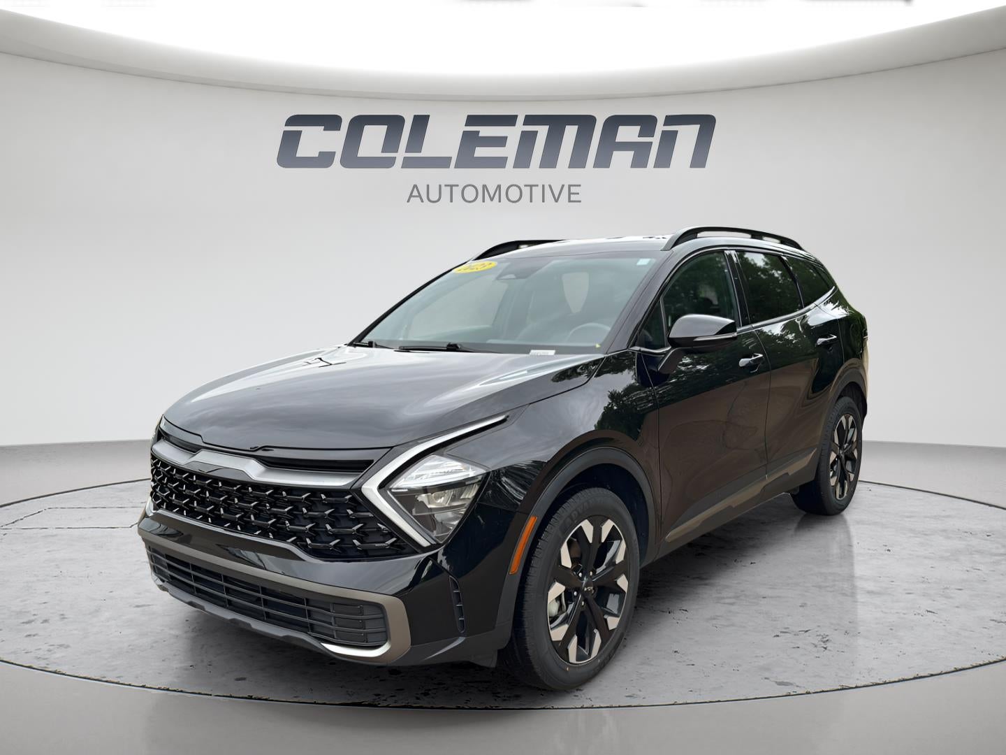 2023 Kia Sportage X-Line in Ebony Black — front three-quarter view